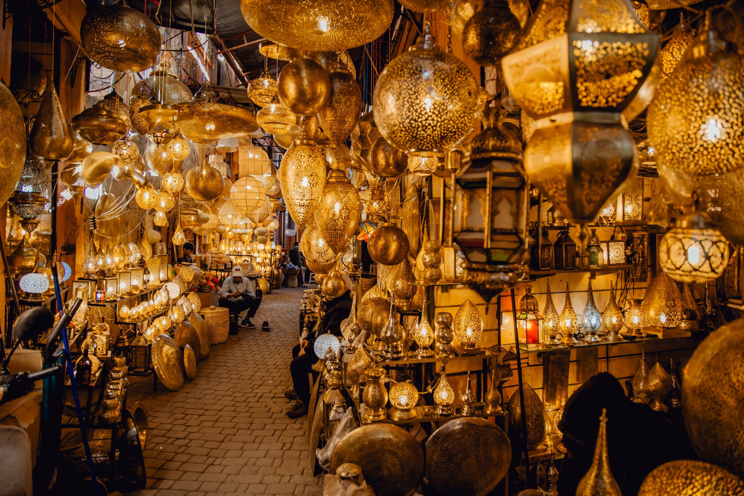 Hundreds of brass lanterns glowing in a Marrakech souk